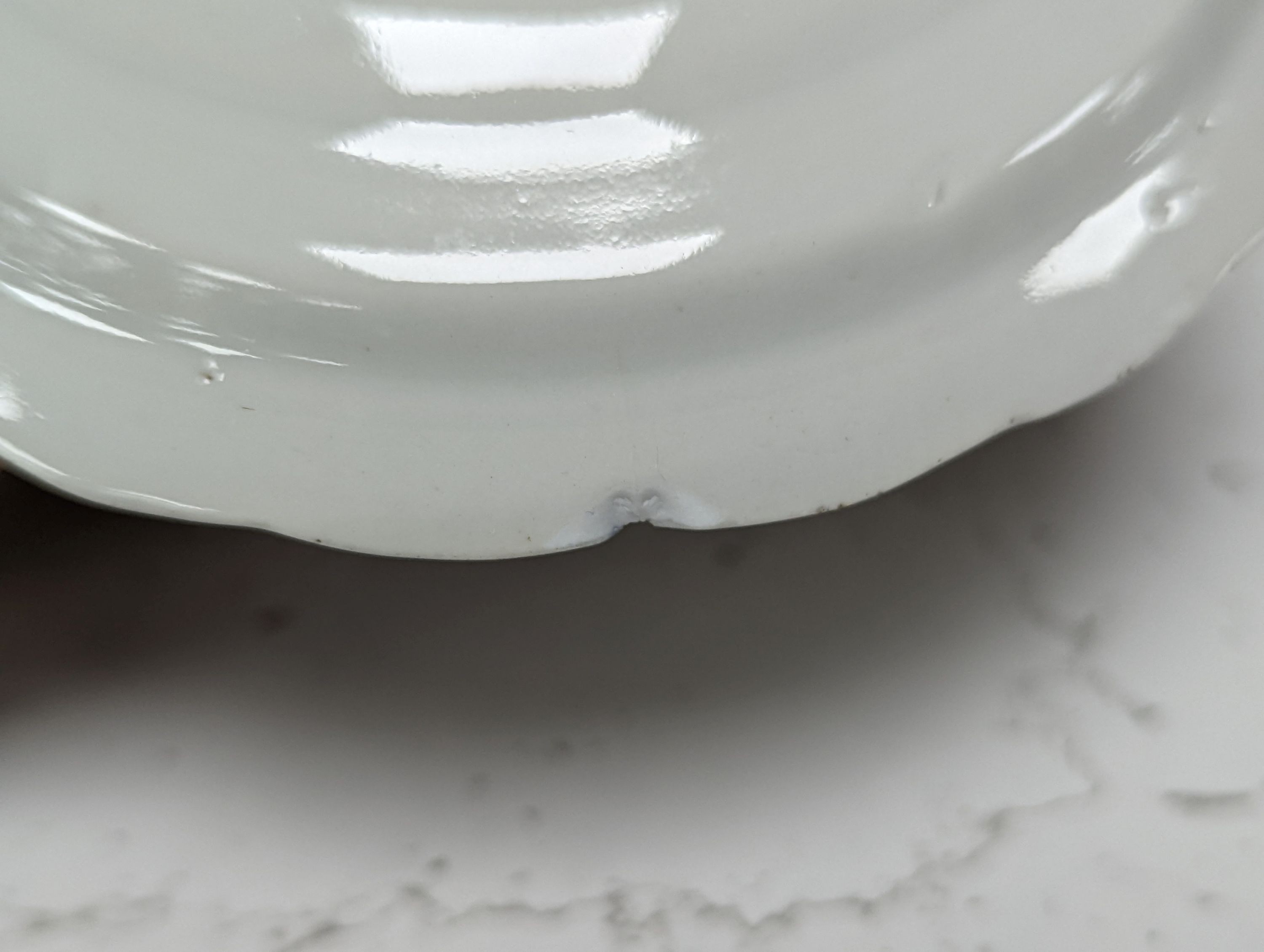 Seven 18th century Chinese saucer dishes, largest 14 cms diameter.